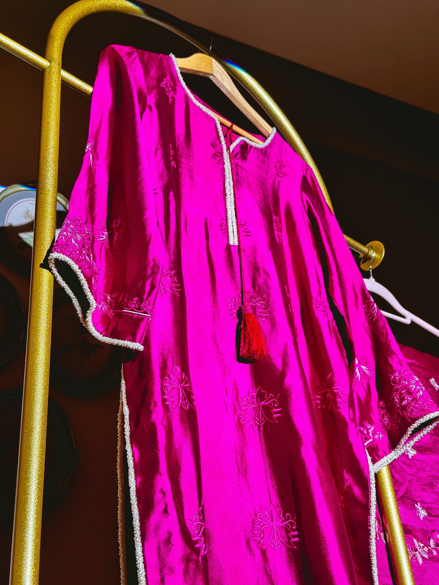 Fuchsia Pakistani three-piece suit with floral embroidery and flowing dupatta