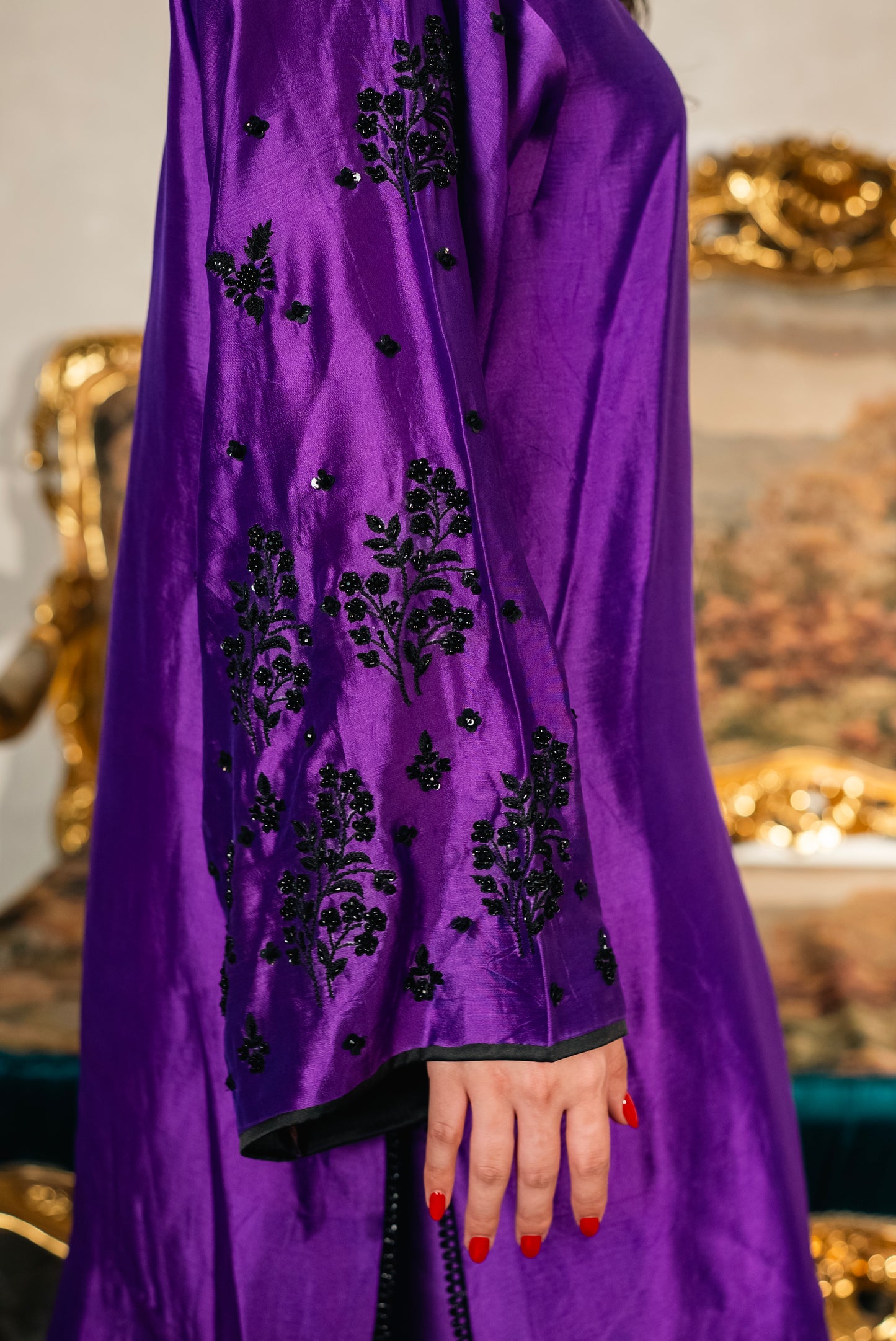 black crystal and thread embroidery on sleeves