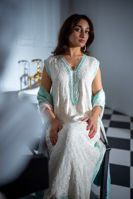 White chiffon-net shirt with aqua-toned embroidery; airy chiffon dupatta in aqua and blush; straight raw silk trousers.